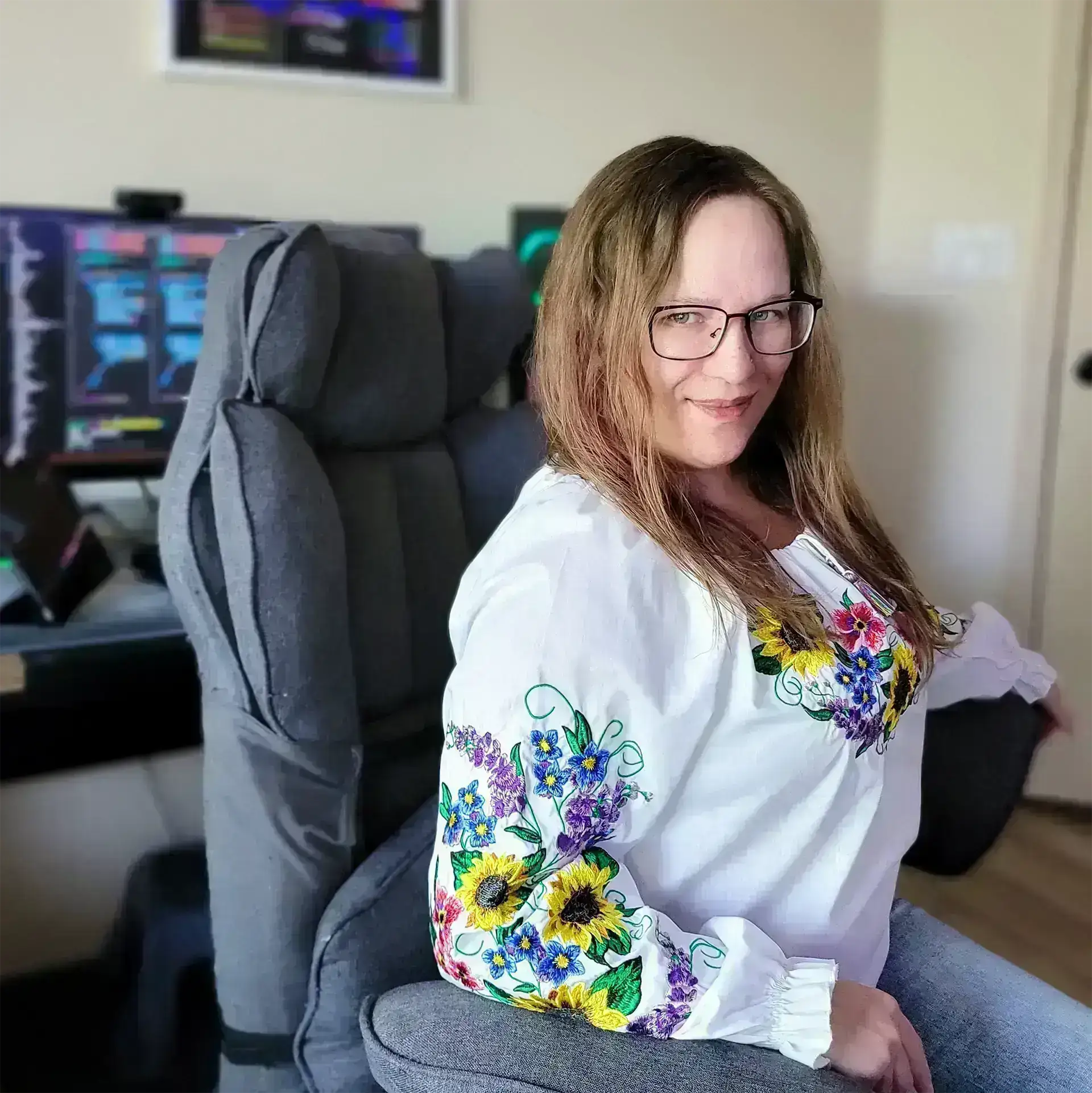 Alisa Pagan sitting at her desk